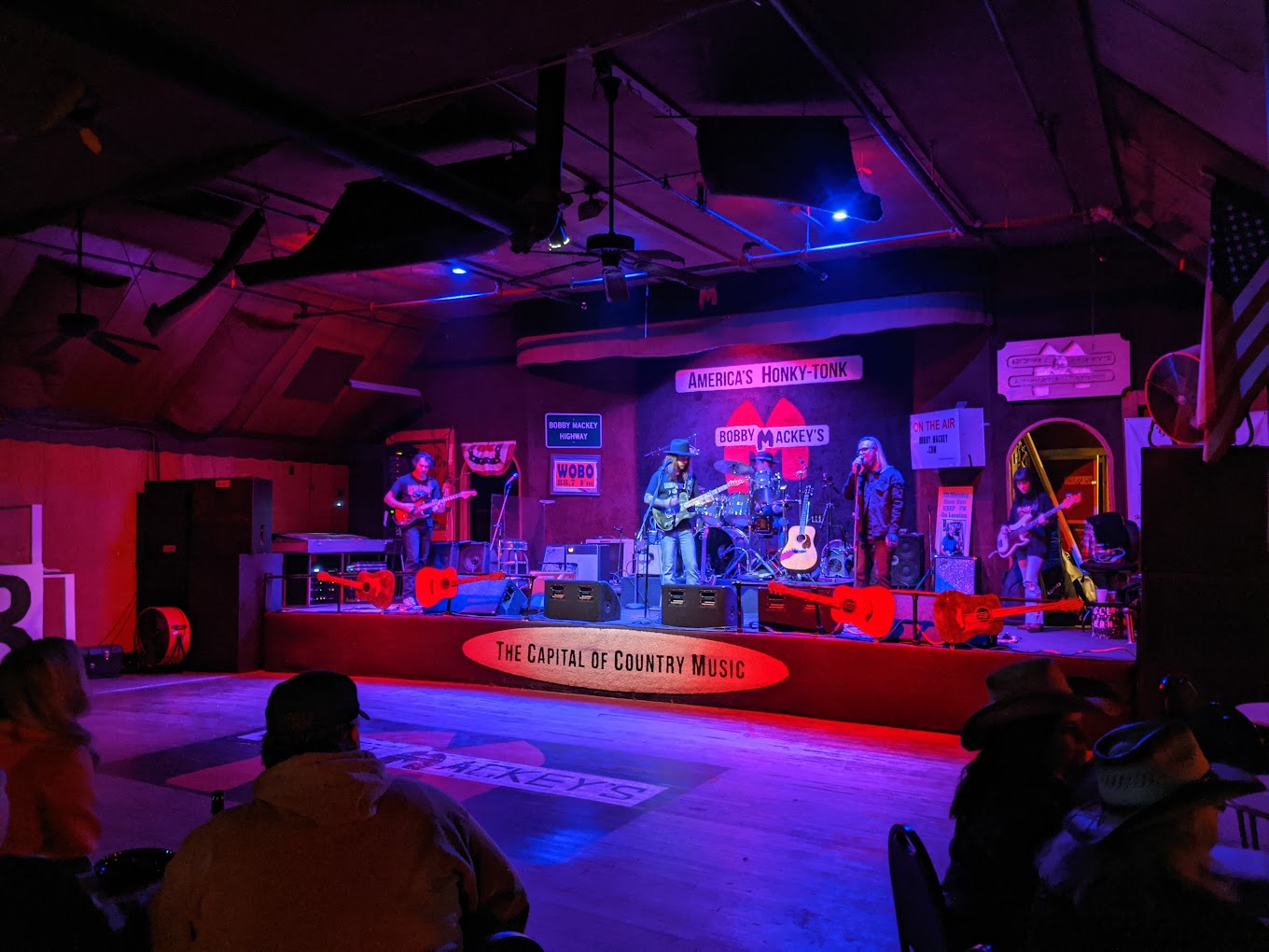 The poster-covered stage at Bobby Mackey's