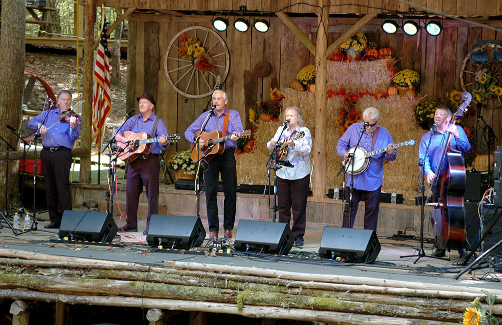 Musicians onstage at a traditional barn venue