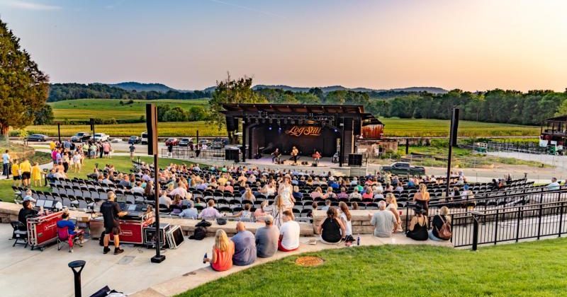 A music amphitheater on a grassy field.